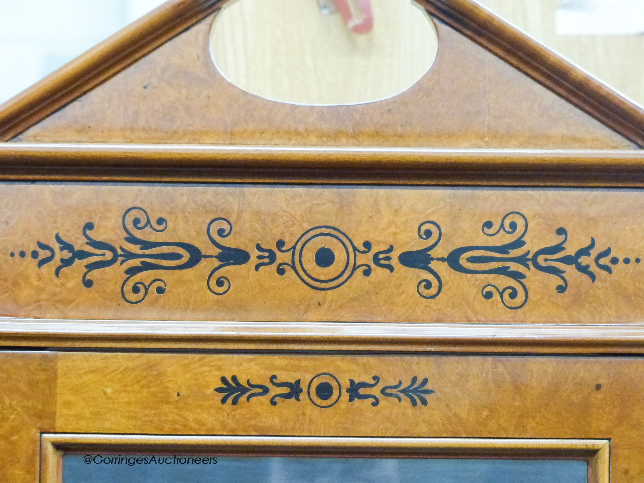 A Biedermeier style ebony inlaid mahogany breakfront display cabinet, W.120cm D.47cm H.197cm